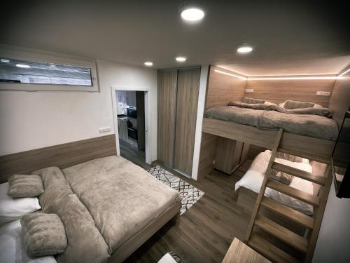 U Králíka, přízemní bezbarierové apartmány A,B,C,D - 50 metrů od vleku - přejdete v lyžácích, pod bobovou dráhou, parkování zdarma, lyžárna s vysoušeči bot,